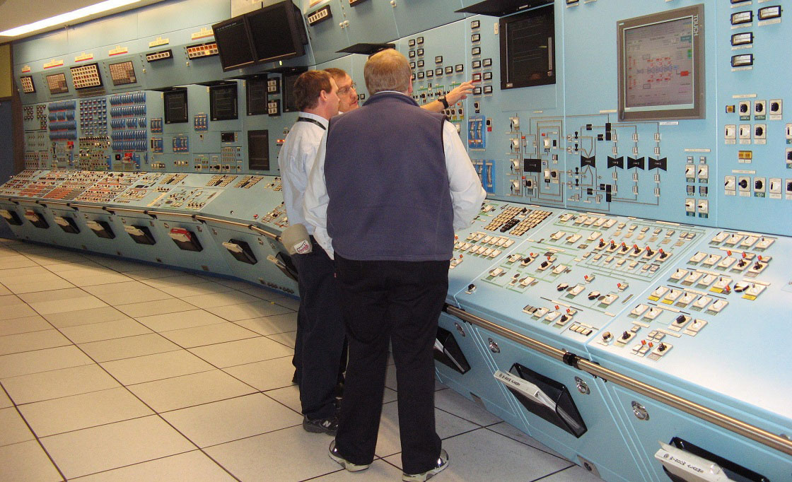 In this file photo NB Power workers examine gauges in a control room simulator at the Point Lepreau nuclear power station on Monday Nov. 29, 2010. 
