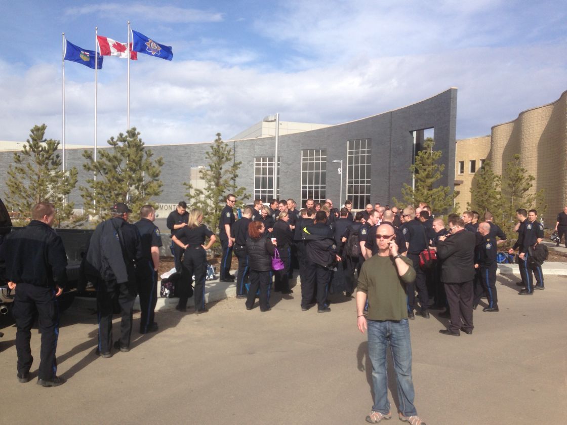 A group of employees stand outside the new Edmonton Remand Centre Friday, April 26, 2013. 