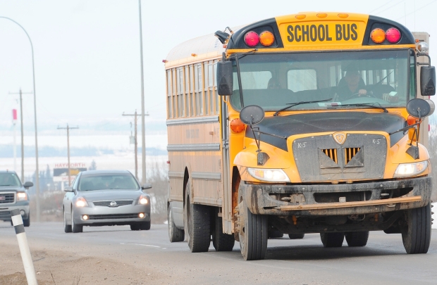 A school bus drives along Highway 60 near Yellowhead trail on April 2, 2013.