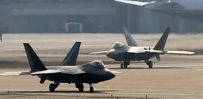 Two U.S. Air Force F-22 Raptor stealth fighter jets wait to take off during a military exercise at the Osan U.S. Air Base in Pyeongtaek, south of Seoul, South Korea. (AP Photo/Bae Jung-hyun, Yonhap) .