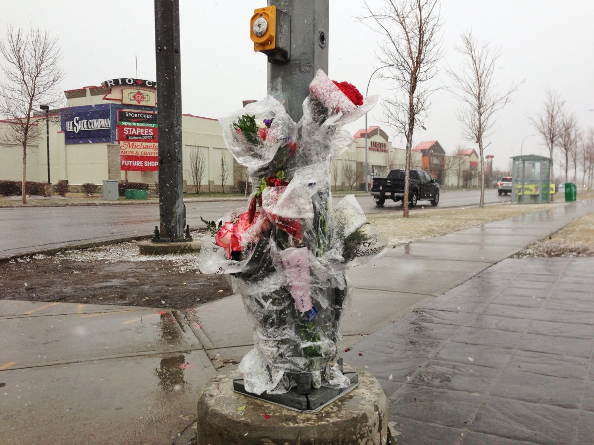 A memorial is growing at the intersection where a 2-year-old girl was killed.