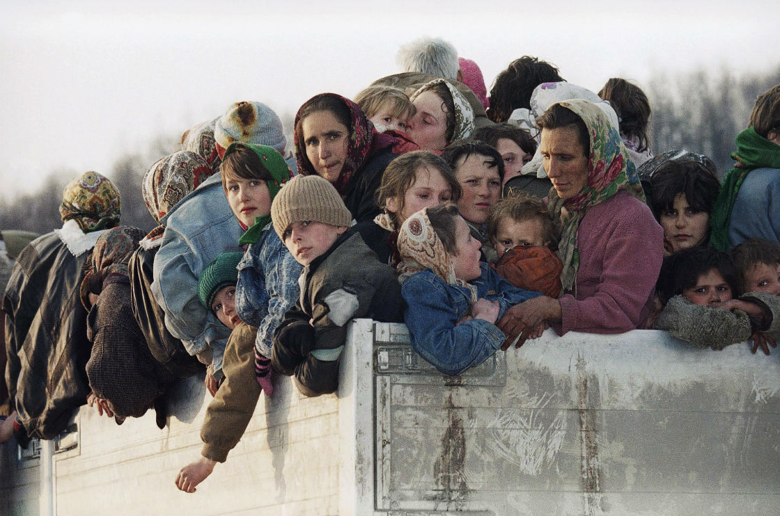  In this Monday March 29, 1993 file photo evacuees from the besieged Muslim enclave of Srebrenica, packed on a truck en route to Tuzla, pass through Tojsici, 56 miles north of Sarajevo. 