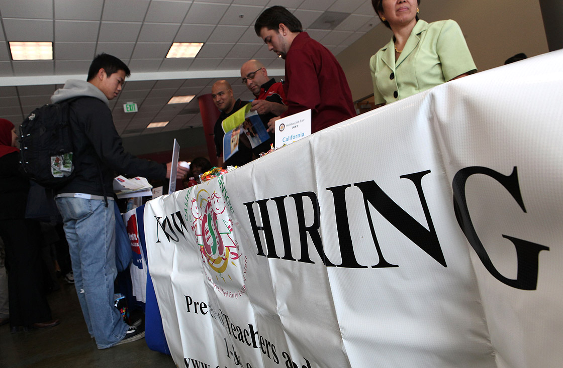 A Skyline College student talks to recruiters during a job fair November 4, 2009 in San Bruno, California.