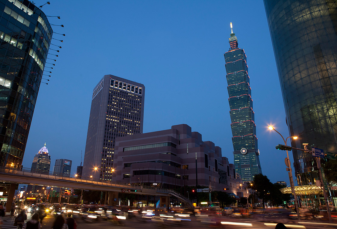 Traffic pass before Taipei 101 building in Taipei’s Hsin-yi district on April 15, 2013 in Taipei, Taiwan.