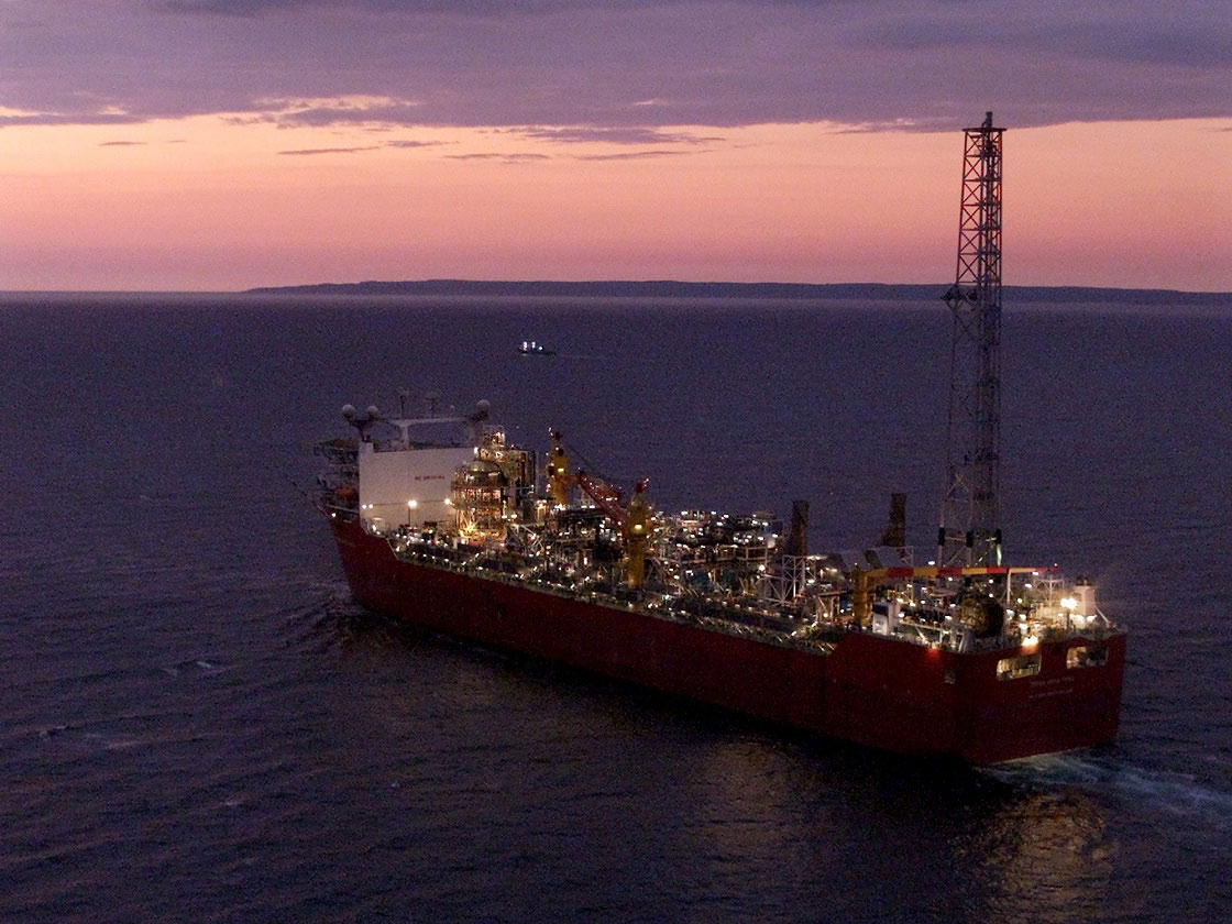 Terra Nova FPSO, a massive floating production, storage and offloading vessel used in the oil and gas industry, heads along the Newfoundland coast in the early morning hours on Friday, Aug. 3, 2001.