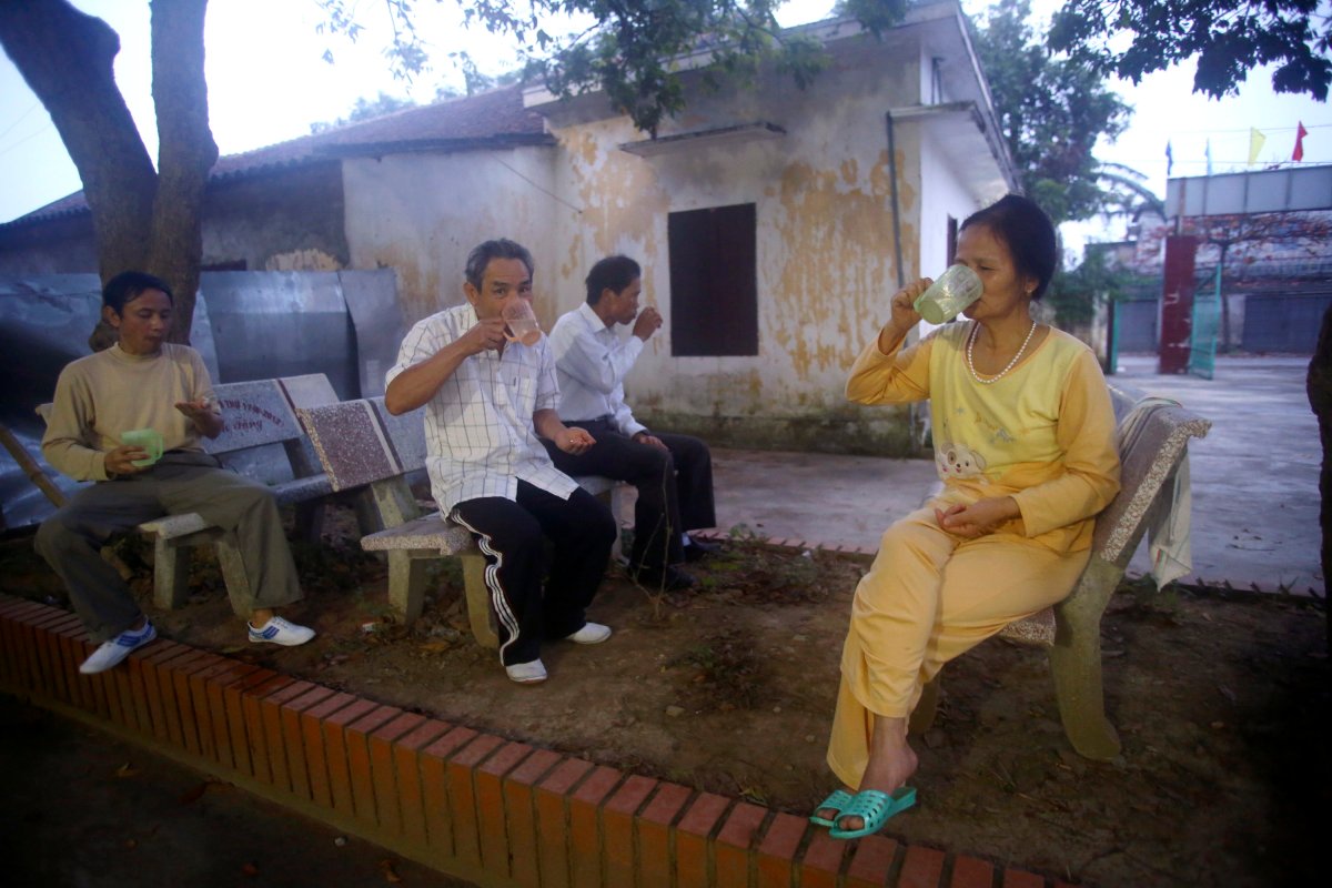 In this photo taken March 18, 2013, patients at the Scientology Health Center of the Vietnam Association of Agent Orange Victims take a dose of 35 vitamins in the early morning in Thai Binh, Vietnam. The center runs a 25-day health program which, as well as massive consumption of vitamins, includes four-hour sauna sessions and a morning run. While there is no medical evidence that the treatment at the center is effective, Vietnamese authorities are supporting it as a way of relieving some of the suffering of the between 2 and 4 million people suffering from illnesses linked to exposure to Agent Orange during the war. 