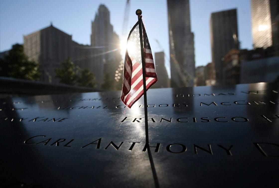 A flag sits atop one of the panels around the north pool during observances for the eleventh anniversary of the terrorist attacks on lower Manhattan at the World Trade Center site September 11, 2012 in New York City. 