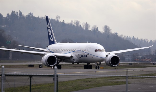 FILE - This Feb. 11, 2013 file photo shows a Boeing 787 flight test jet taxing following a test flight, at Boeing Field, in Seattle.