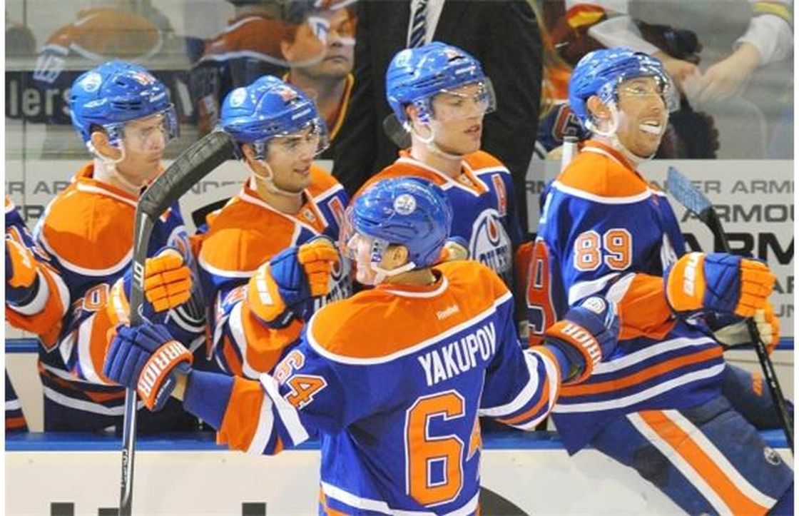 Nail Yakupov of the Edmonton Oilers celebrates a hat trick with the bench against the Vancouver Canucks at Rexall Place in Edmonton on Saturday, April 27, 2013.
