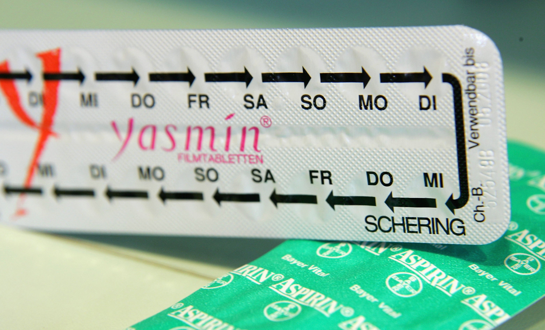 Packages of Bayer aspirin and Schering Yasmin contraceptive pills lie on a table at a pharmacy on March 24, 2006 in Berlin, Germany.