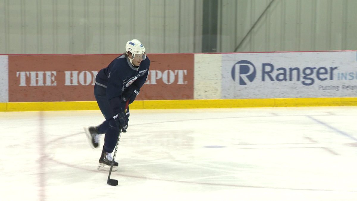 The Winnipeg Jets recalled defenceman Zach Redmond from the AHL.