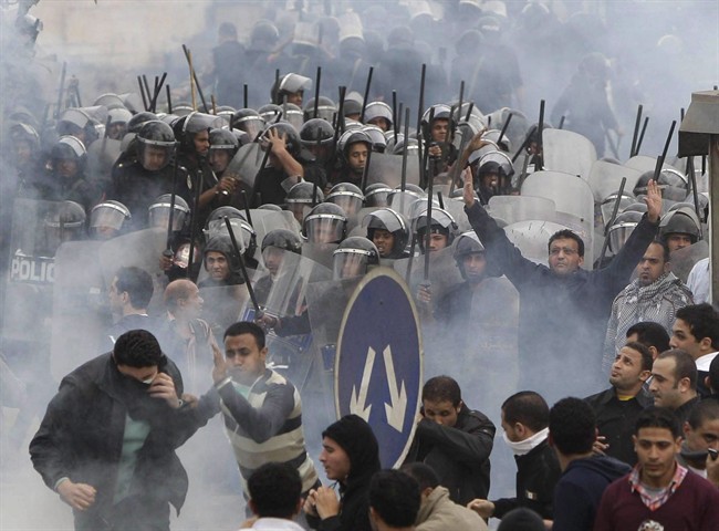 Egyptian anti-government activists clash with riot police in Cairo, Egypt in this Jan. 28, 2011 file photo. 
