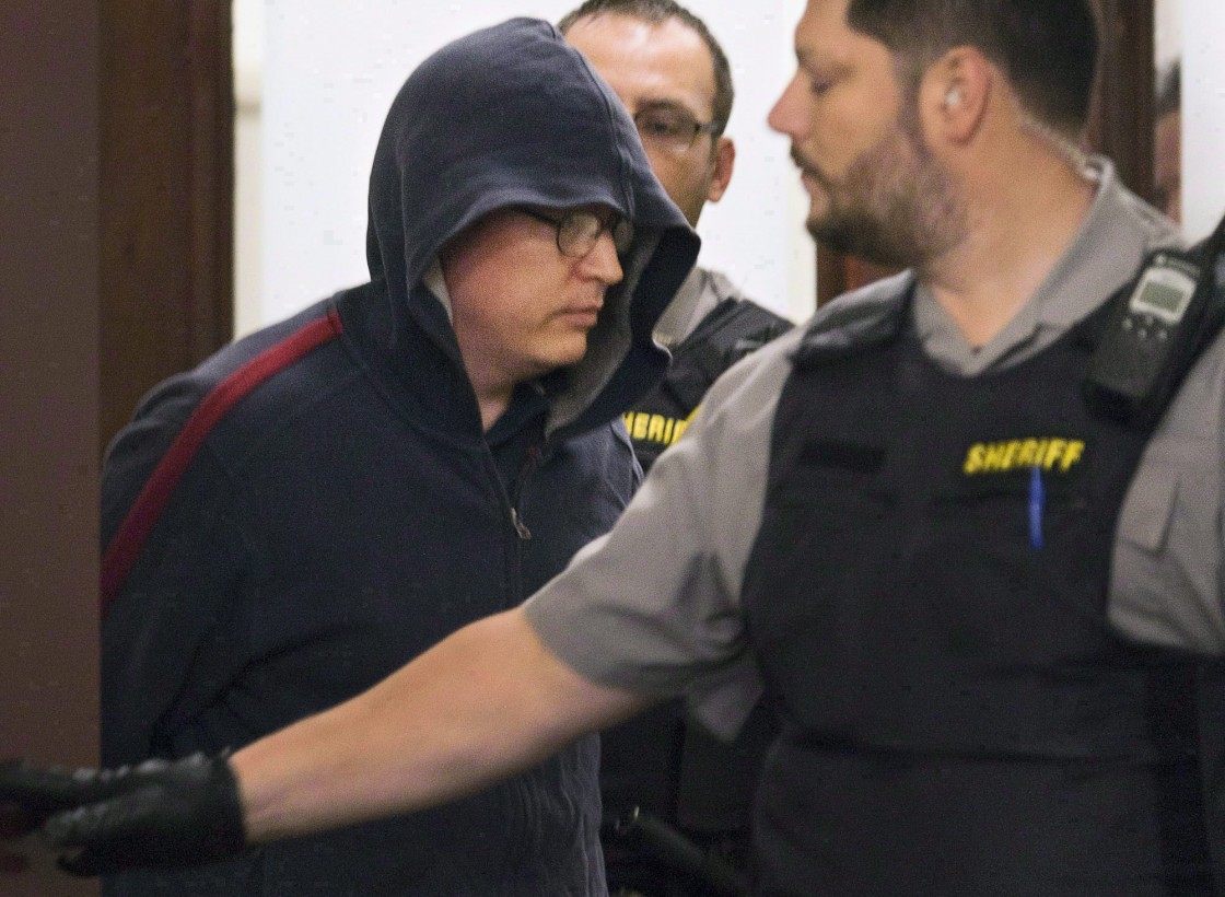 Jeffrey Paul Delisle leaves court in Halifax on Oct. 10, 2012.