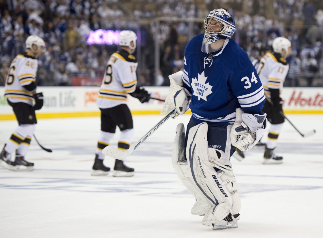 Toronto Maple Leafs goaltender James Reimer skates back on the ice as the Boston Bruins celebrate their empty net goal during third period first round NHL playoff action in Toronto on Monday May 6, 2013.
