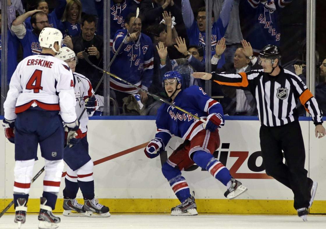 Washington Capitals defenseman John Erskine (4) watches as New York Rangers center Derek Stepan (21) reacts after scoring the winning goal in their 4-3 victory during the third period of Game 3 of their first-round NHL hockey Stanley Cup playoff series in New York, Monday, May 6, 2013.