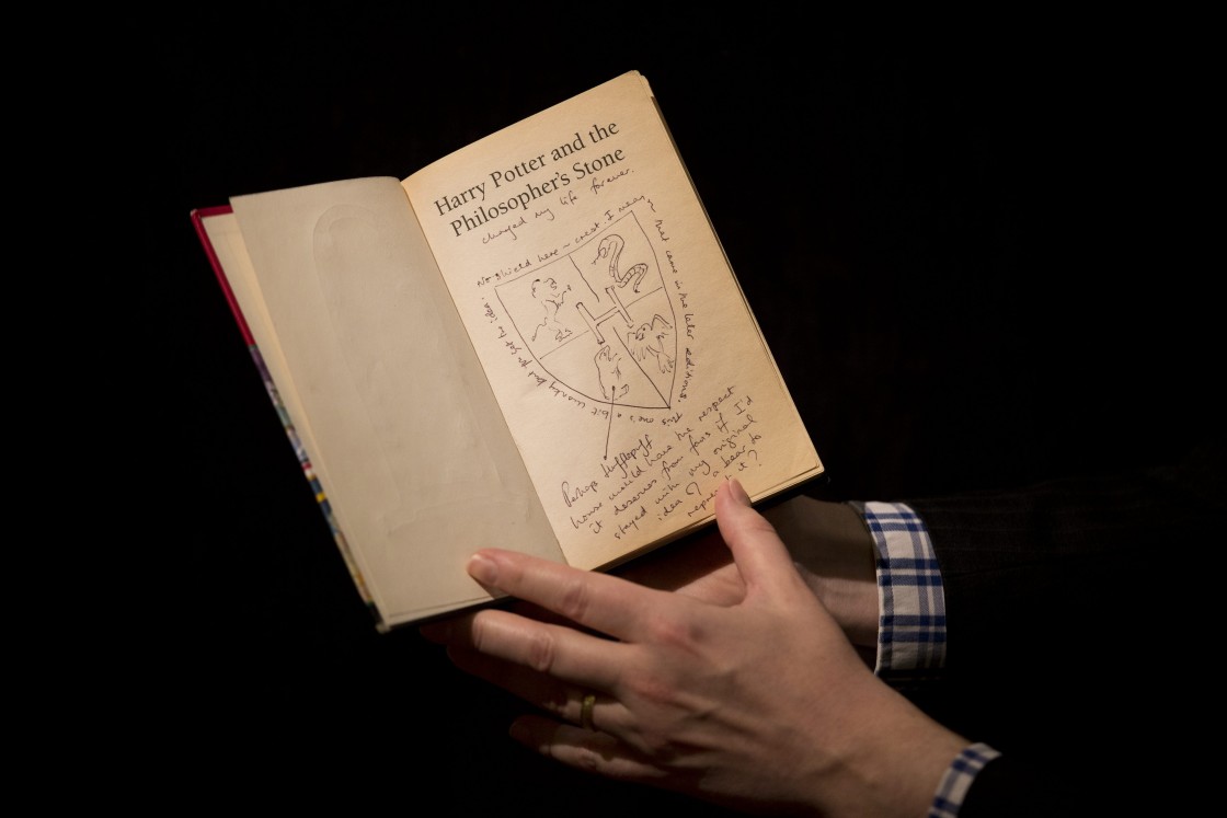 A first edition copy of "Harry Potter and the Philosopher's Stone" containing annotations and illustrations by author J.K. Rowling.