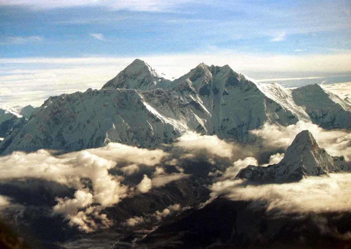The southern face of Mount Everest, known locally as Sagarmatha, soars above the monsoon clouds Saturday, August 26, 2000 at the border of Nepal and Tibet.