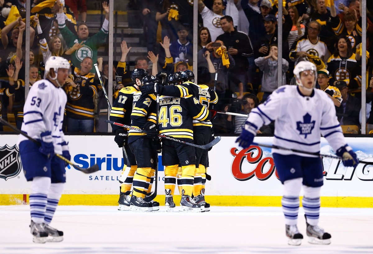 Johnny Boychuk of the Boston Bruins celebrates with teammates including David Krejci after scoring in the second period against the Toronto Maple Leafs in Game One of the Eastern Conference Quarterfinals during the 2013 NHL Stanley Cup Playoffs on May 1, 2013 at TD Garden in Boston, Massachusetts. (Photo by Jared Wickerham/Getty Images).