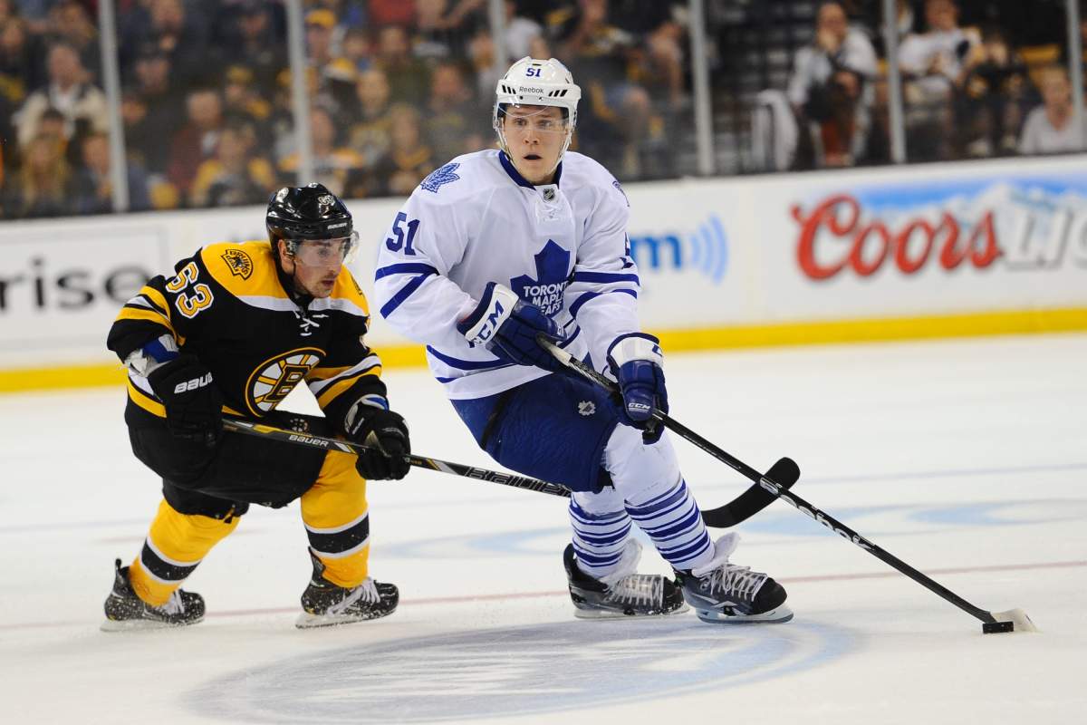 Jake Gardiner #51 of the Toronto Maple Leafs skates against Brad Marchand #63 of the Boston Bruins in Game Five of the Eastern Conference Quarterfinals during the 2013 NHL Stanley Cup Playoffs at TD Garden on May 10, 2013 in Boston, Massachusetts.