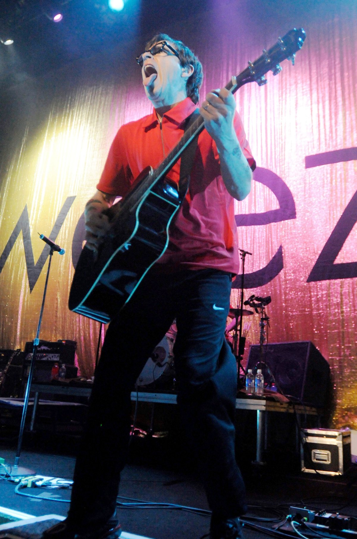 Rivers Cuomo performs at a Weezer concert. 