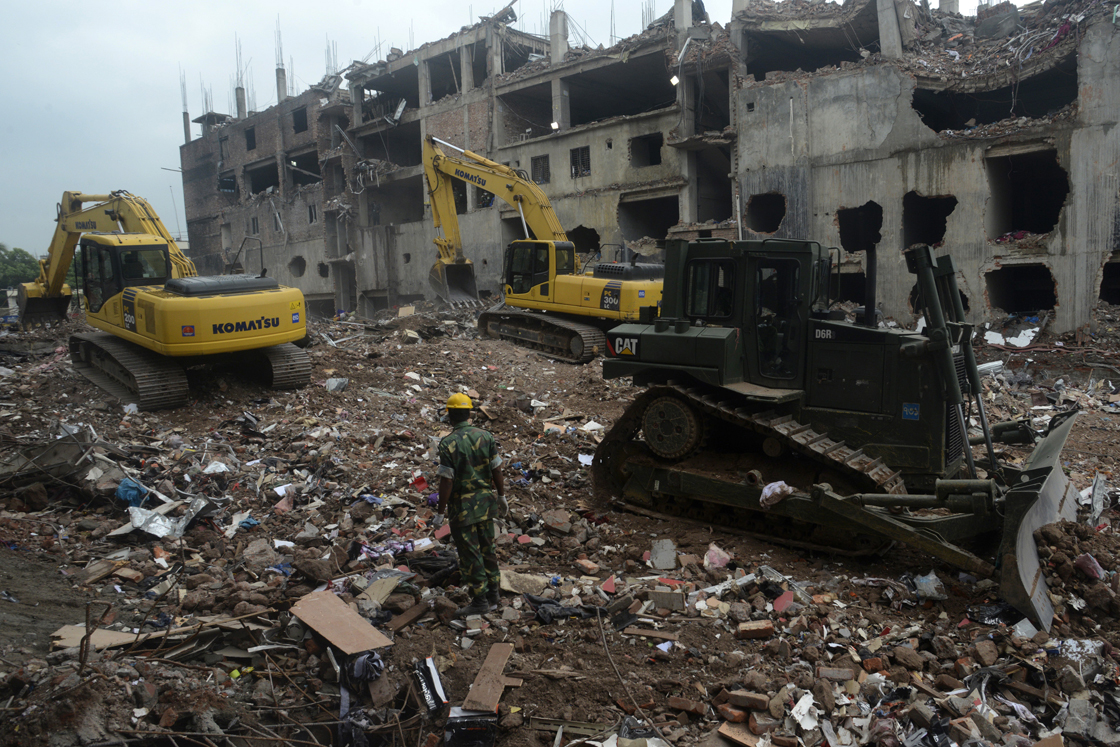 Bangladesh Army personnel continue the second phase of the rescue operation using heavy equipment after an eight-storey building collapsed in Savar, on the outskirts of Dhaka, on May 12, 2013.