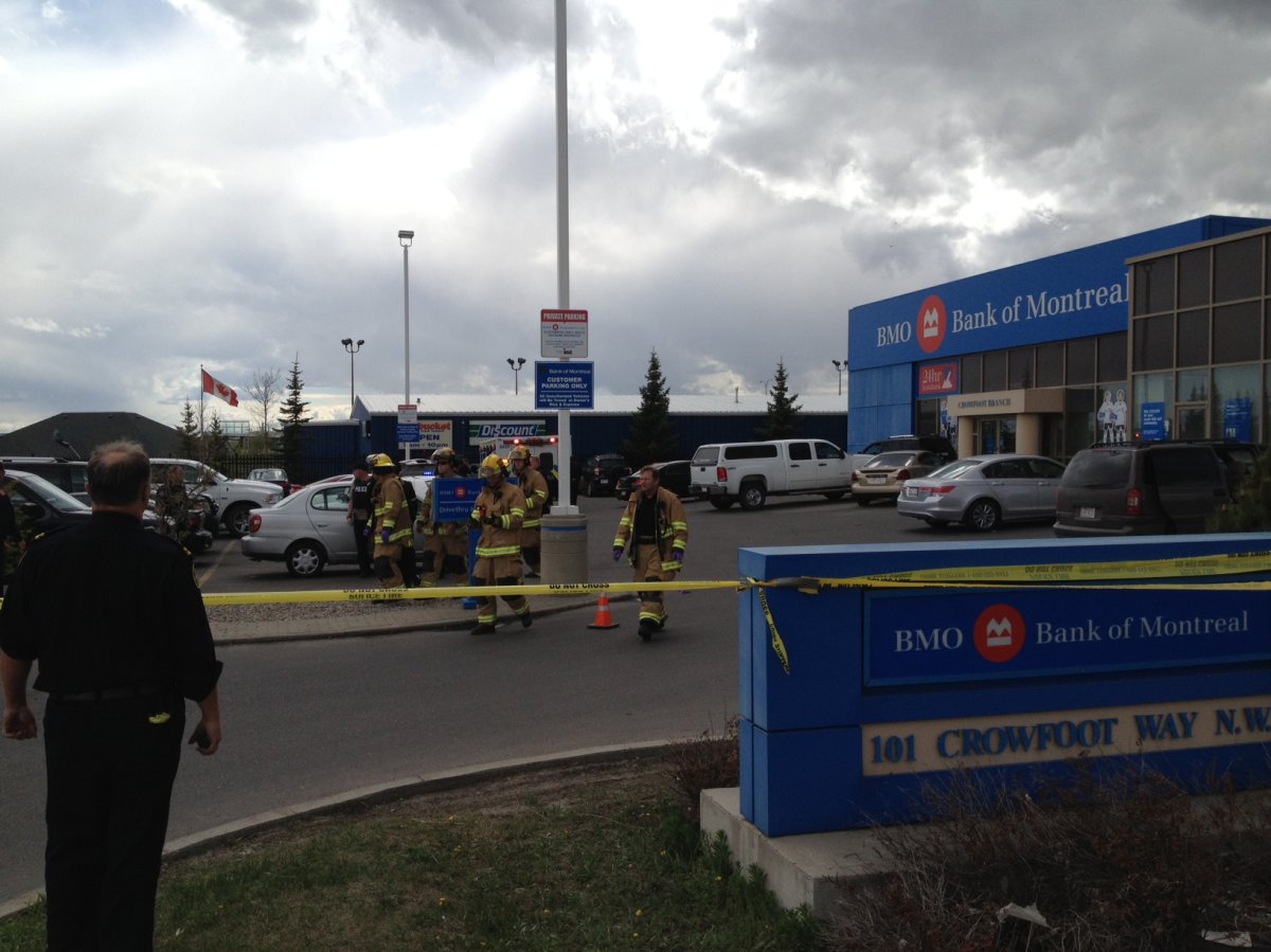 Emergency crews taped off the 100 block of Crowfoot Way N.W. after a shooting.