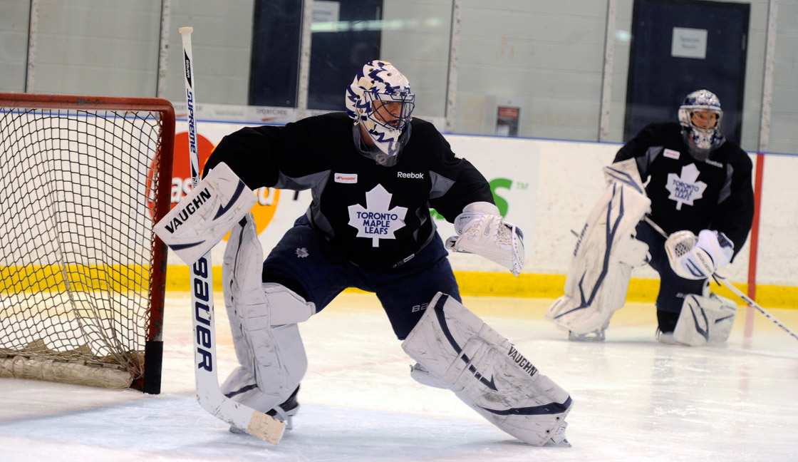 Goalie Drew MacIntyre has joined the Maple Leafs as an emergency replacement for backup Ben Scrivens (pictured centre), who is attending his grandfather's funeral in Alberta.