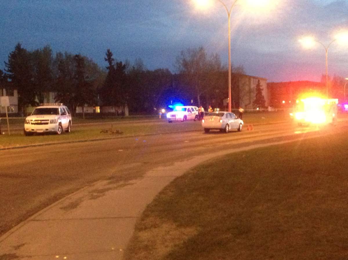 Police investigate after 12-year-old boy seriously injured in collision at 137 Avenue and 42 Street, May 12, 2013. 