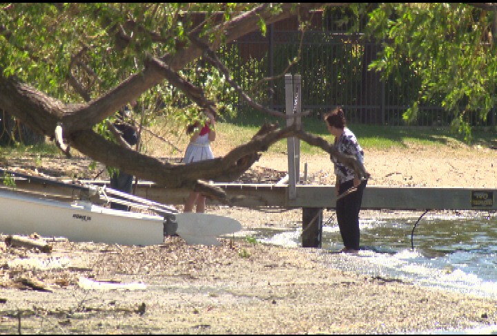 Family members gather at the scene where Martens' body was found. 