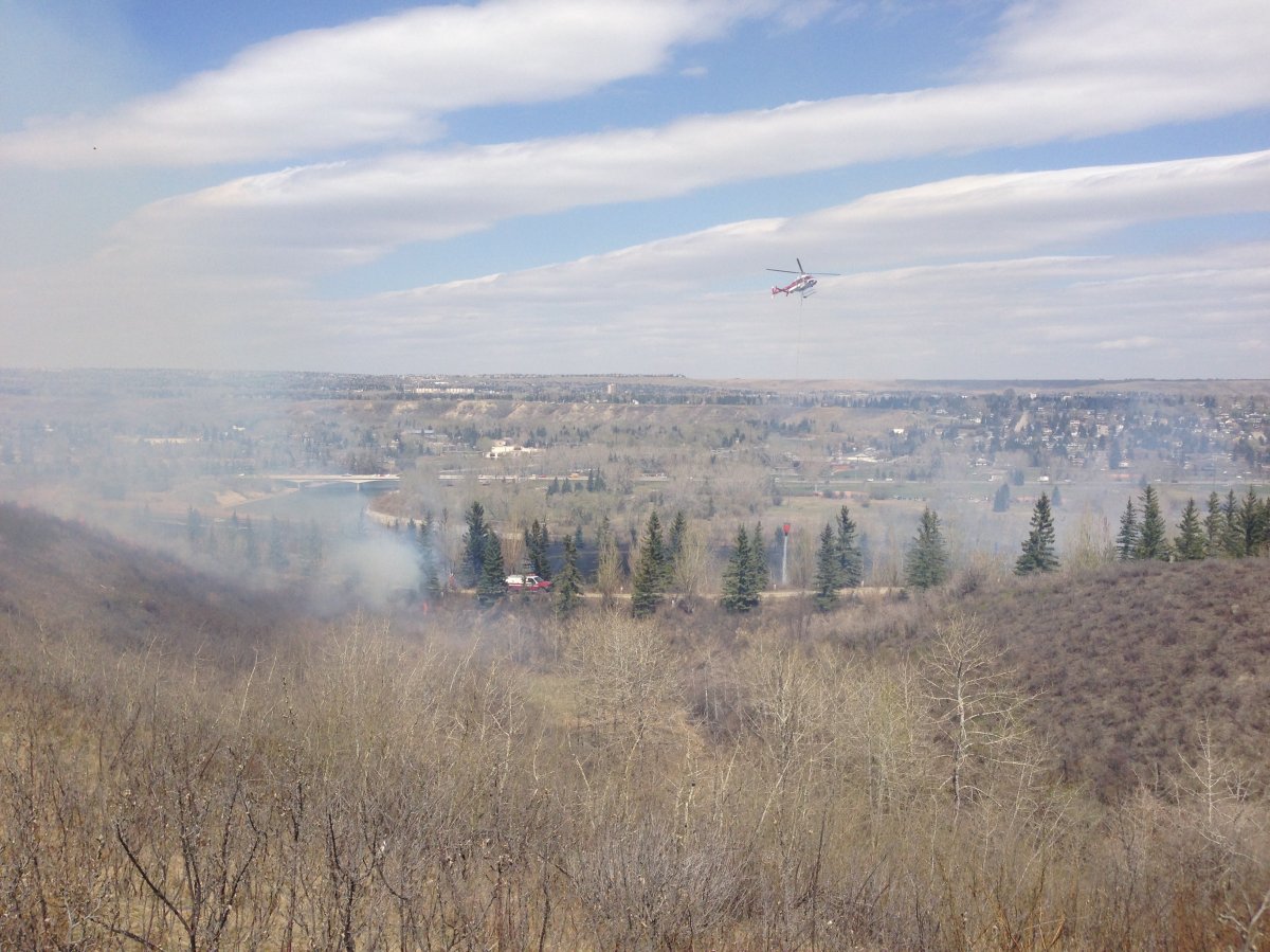 Aerial fire fighters take on a large grass fire in northwest Calgary.