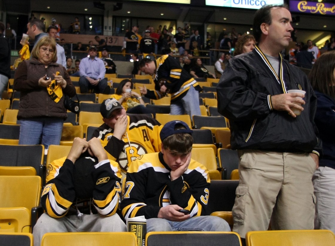 Boston Bruins fans react after their team lost to the Philadelphia Flyers in Game Seven of the Eastern Conference Semifinals during the 2010 NHL Stanley Cup Playoffs