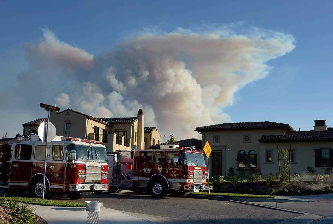A large plum of smoke rises from an out of control wildfire on May 2, 2013 in Newbury Park, California.