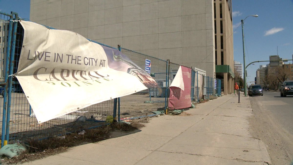 A sign for Capital Pointe blows in the wind. Work to remove underground power boxes at the site is expected to begin May 21.