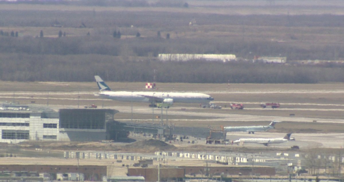 Cathay Pacific Boeing 777 sits on tarmac in Winnipeg after diverting due to emergency warning light on May 9, 2013.