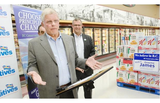 John Cummins tells an audience at a Kelowna grocery store Tuesday that a Conservative government would ease regulations on the sale of beer and wine.

