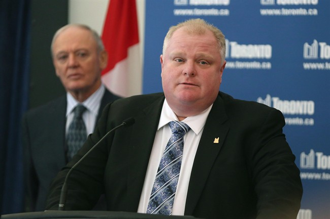 Toronto Mayor Rob Ford, right, is flanked by Deputy Mayor Doug Holyday in Toronto in a Jan. 2013. 
