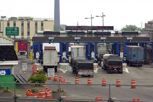 Transport traffic entering the United States line-up for the customs inspection plaza after crossing the Peace Bridge from Canada in Buffalo, N.Y., on May 26, 2004.