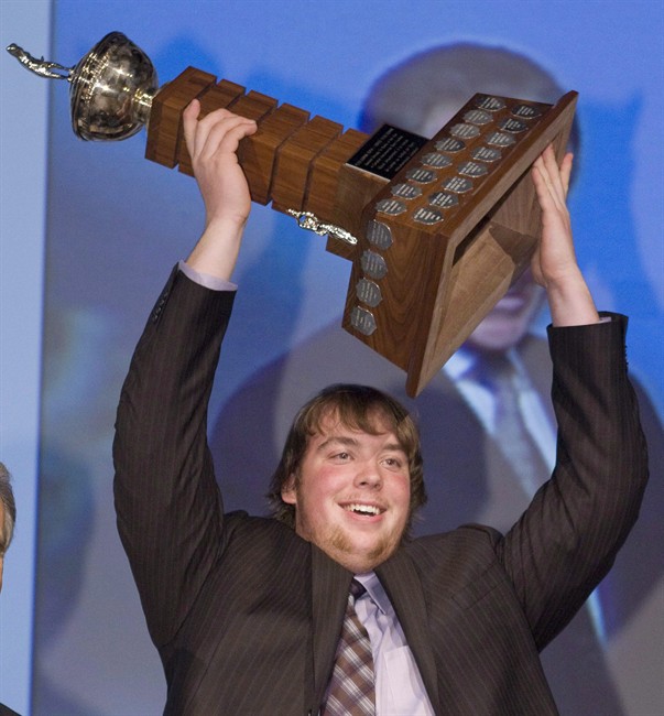University of Calgary Dinos defensive tackle Linden Gaydosh, of Peace River, Alta., holds the Peter Gorman trophy as rookie of the year at the CIS awards ceremony Thursday, Nov.26, 2009 in Quebec City.The Hamilton Tiger-Cats have selected Gaydosh first overall in the CFL draft. 