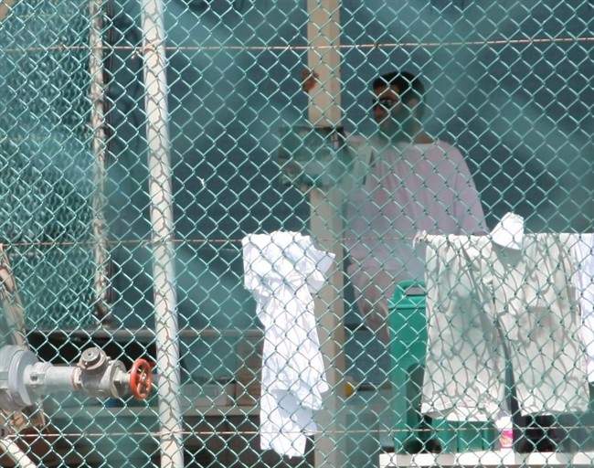 Omar Khadr is seen in Guantanamo Bay's Camp 4 on October 23, 2010, days before the 24-year-old Canadian was convicted of five war crimes and sentenced to eight more years. Khadr woke up in an Alberta prison Wednesday after months stuck in isolation at a penitentiary in Ontario where an inmate had threatened his life, The Canadian Press has learned.T.
