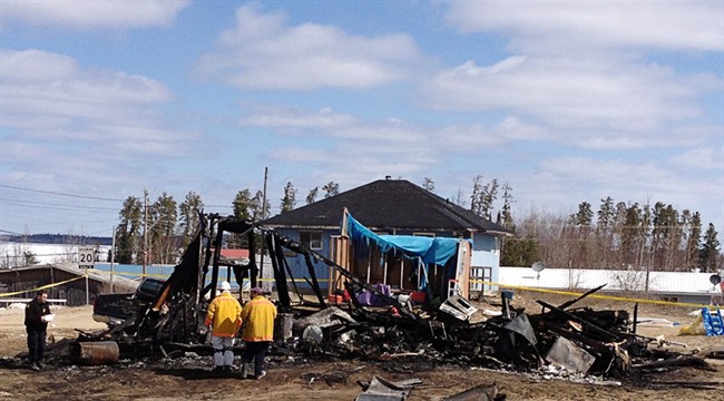 The remains of a house at Wunnumin Lake First Nation where two little girls and their aunt were killed in a 2013 fire is shown in a handout photo. Ottawa says it stopped collecting data on such fires six years ago.
