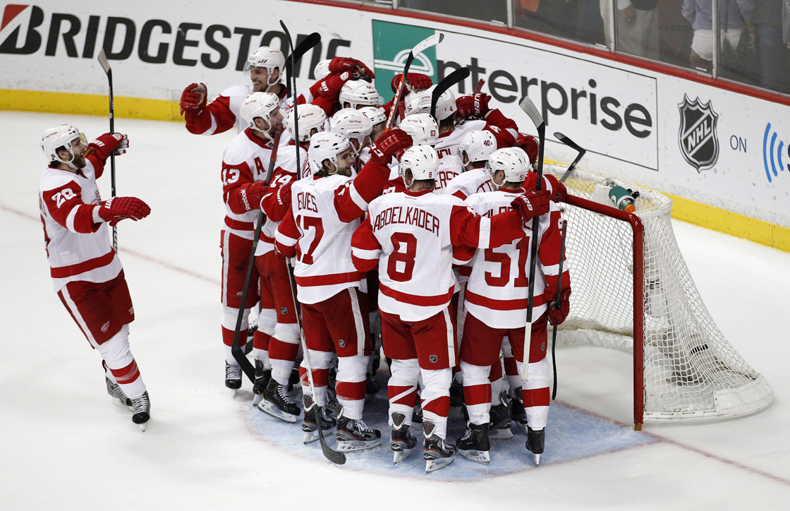 The Detroit Red Wings celebrate their 3-2 win over the Anaheim Ducks in Game 7 of their first-round NHL hockey Stanley Cup playoff series in Anaheim, Calif., Sunday, May 12, 2013.
