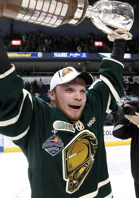 London Knights' Max Domi lifts the Ontario Hockey League Championship trophy after game seven action against the Barrie Colts Monday May 13, 2013 in London, Ont.