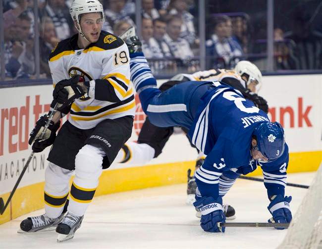 Boston Bruins centre Tyler Seguin (19) dumps Toronto Maple Leafs defenceman Dion Phaneuf during first period first round NHL playoff action in Toronto on Monday May 6, 2013.