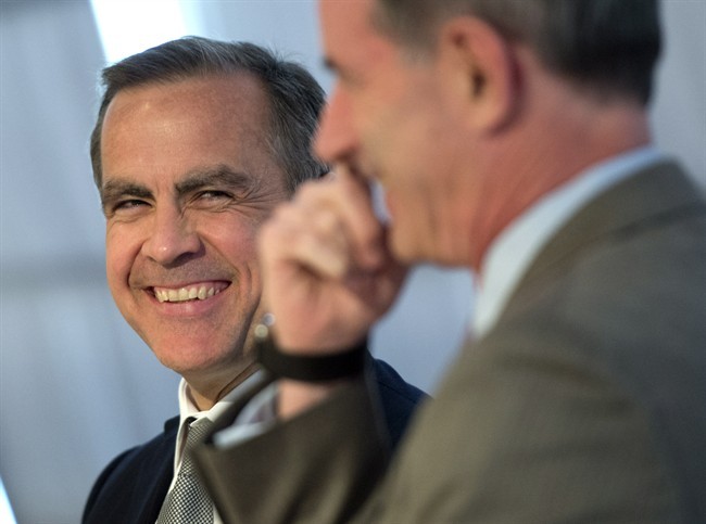 Bank of Canada governor Mark Carney shares a laugh as he participates in a panel discussion about Rebuilding Trust in Global Banking, organized by Cardus' The Convivium Project. The panel was held at the Toronto Board of Trade on Friday May 3, 2013.