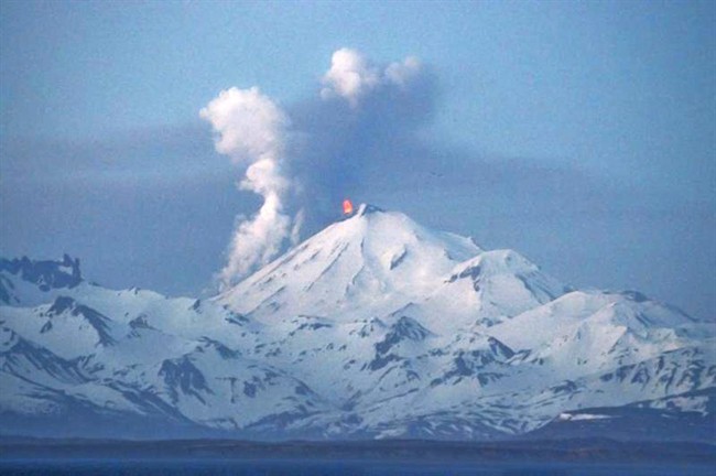 In this photo provided by the Alaskan Volcano Observatory, the Pavlof volcano erupts Thursday, May 16, 2013, as seen from the air from the southwest in Cold Bay, Alaska. 