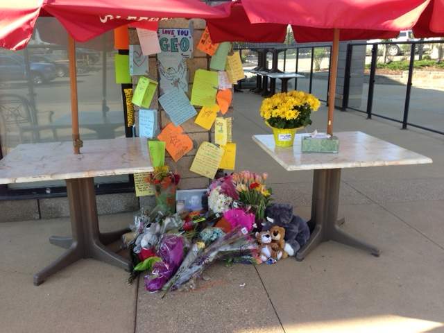 Memorial set up on restaurant patio where 2-year-old boy was killed by accused impaired driver, Tuesday, May 21, 2013.