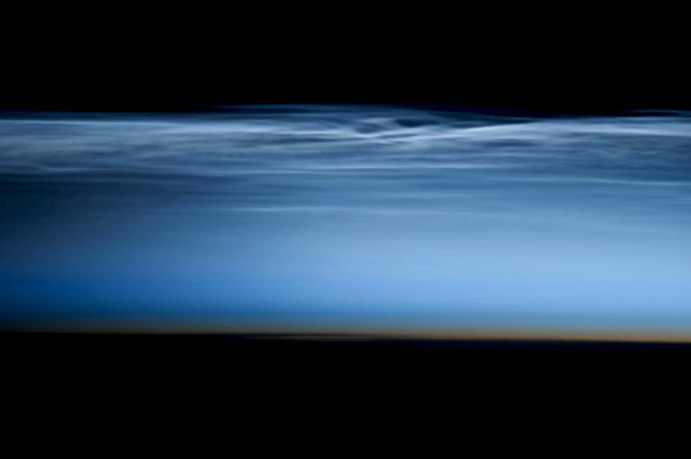 Noctilucent clouds, imaged by Chris Hadfield on January 6, 2013, while he was aboard the International Space Station .
