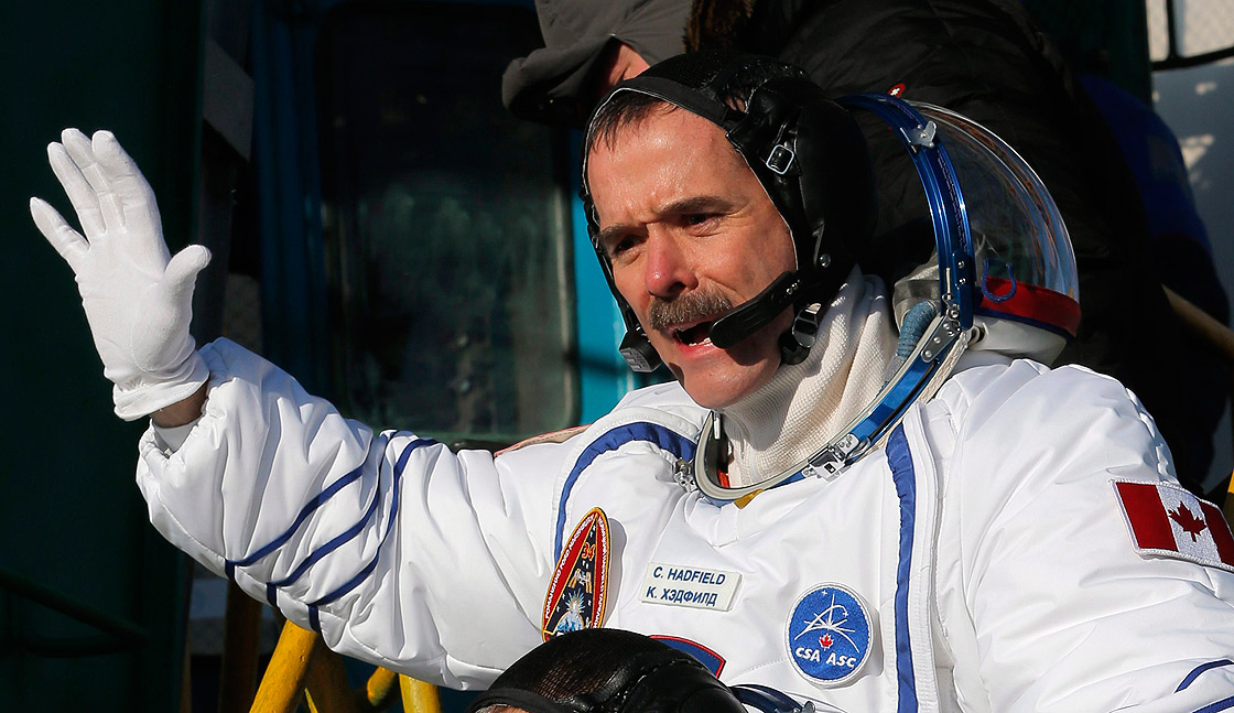 Canadian astronaut Chris Hadfield, a crew member of the mission to the International Space Station, gestures prior the launch of the Soyuz-FG rocket at the Russian leased Baikonur cosmodrome, Kazakhstan, Wednesday, Dec. 19, 2012.