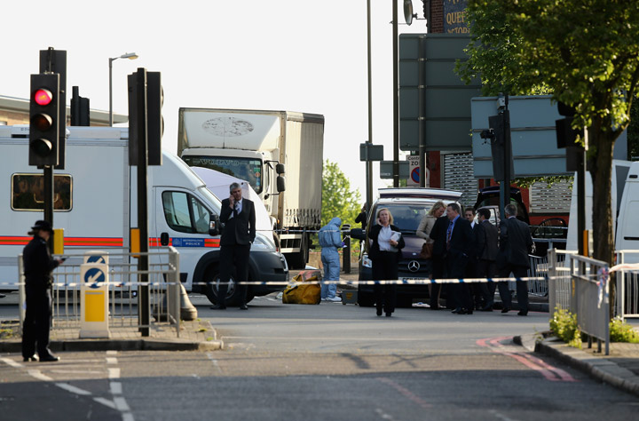 Police at the scene in Woolwich following a major incident in which a man was killed, on May 22, 2013 in London, England. It has been reported that the government and police are treating the attack in Woolwich on a serving soldier as a possible terrorist attack. Police have confirmed that one man has died after being attacked in the street by two men and firearms and knives were involved in the incident. 