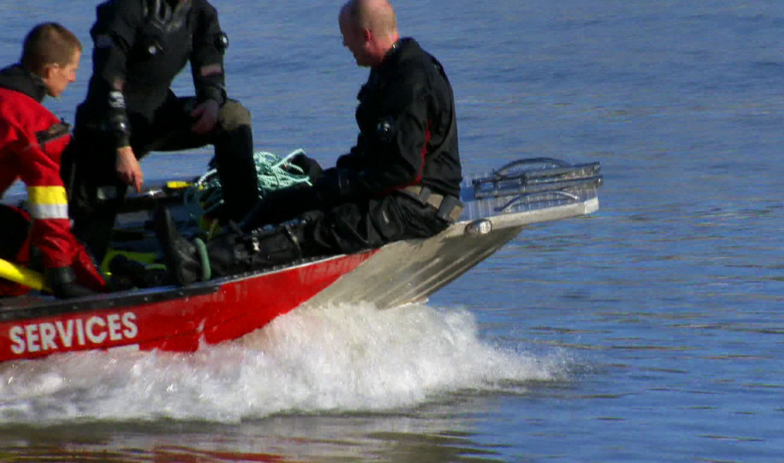 Water rescue team pulls body from the South Saskatchewan River near Clarksboro on Tuesday.